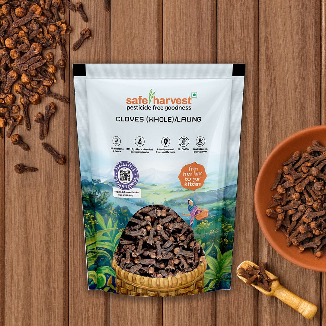 Safe Harvest pesticide-free whole cloves laung in a brown bowl on a wooden surface, NABL lab tested.